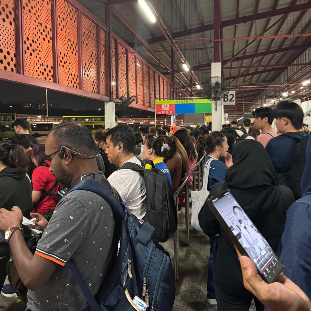 Travelers lining up for Bus 950 at Woodlands to cross from Singapore to Johor Bahru